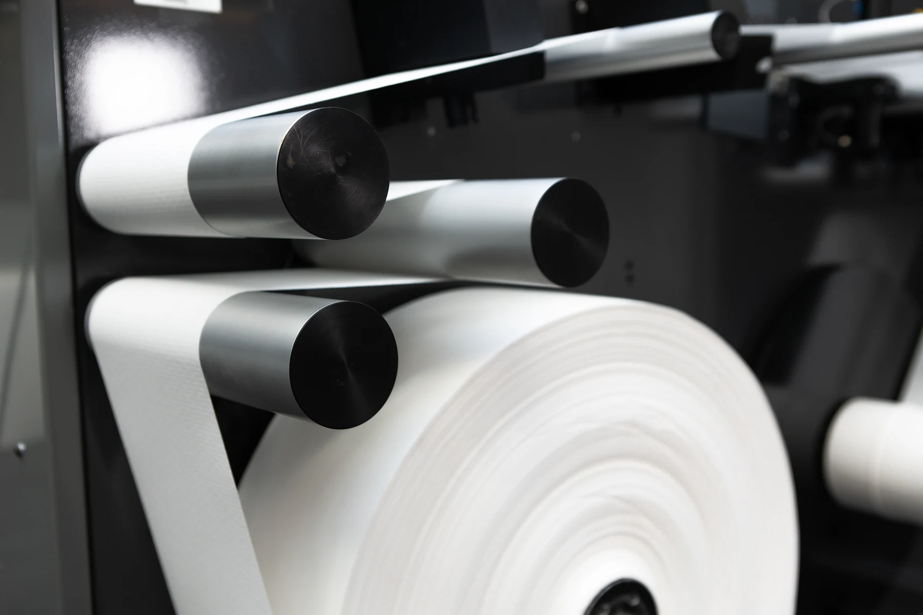 An MD sample roll in a Tapio Analyzer, the paper strip running from the roll over the guide rollers.