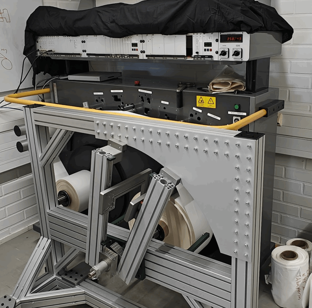 Laboratory setup of a Tapio Analyzer at Aalto University, showing the winding frame, caliper measurement system and multi-probe roundness measurement equipment.
